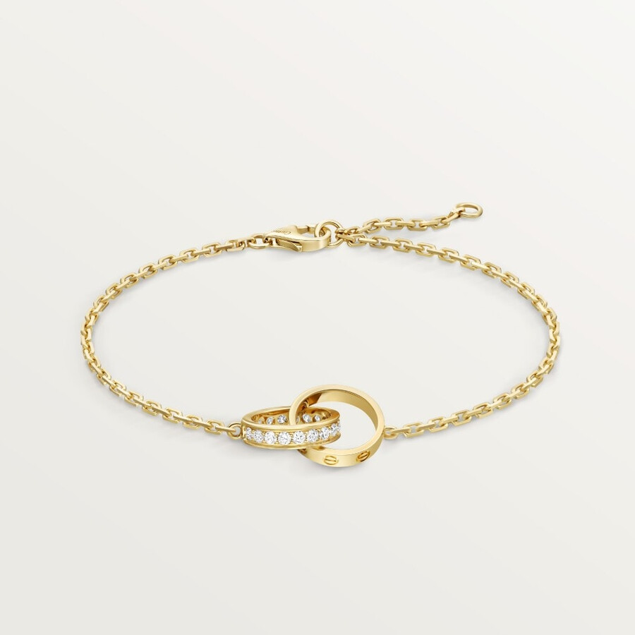 love-armband an einer kette halb mit strasssteinen besetzt