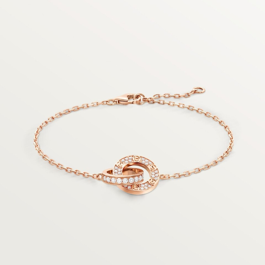 love-armband an einer kette mit strasssteinen besetzt