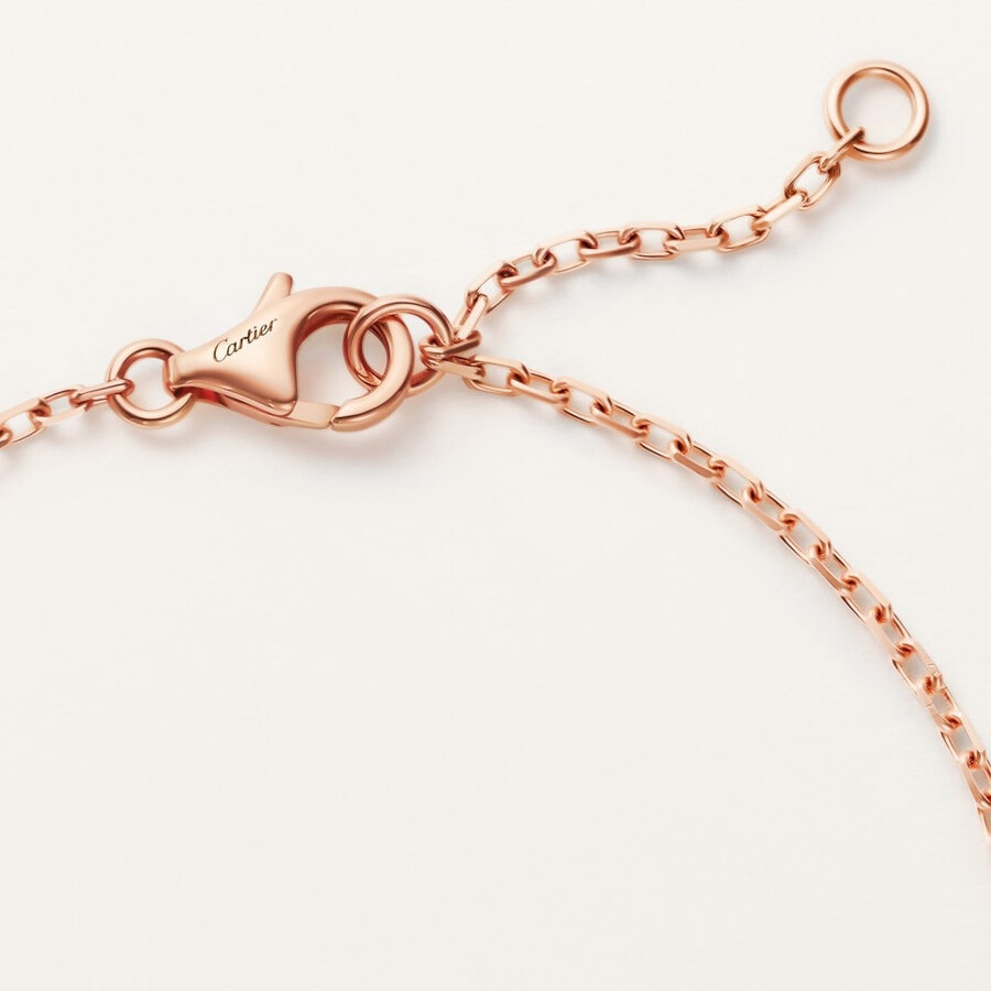 love-armband an einer kette mit strasssteinen besetzt