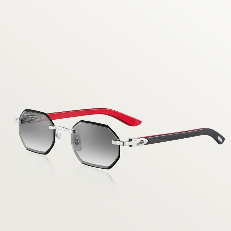 cartier-sonnenbrille mit länglichem c-förmigem design.